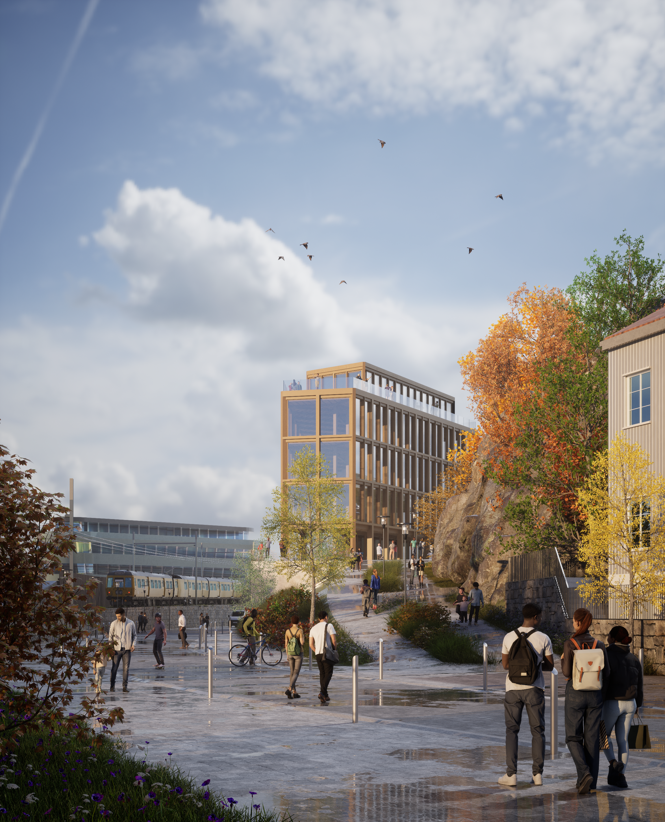 La perspective montre l'implantation de la bibliothèque de Larvik dans le centre ville. On voit le début du chemin piéton vert qui mène au parvis. Au loin, le train longe le bâtiment qui est le point d'entrée de la ville. Cette image montre des étudiants se dirigeant en journée vers le bâtiment pour étudier.